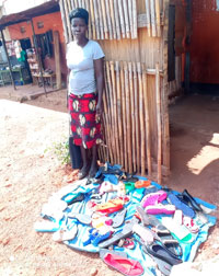 Margaret selling her plastic shoes.